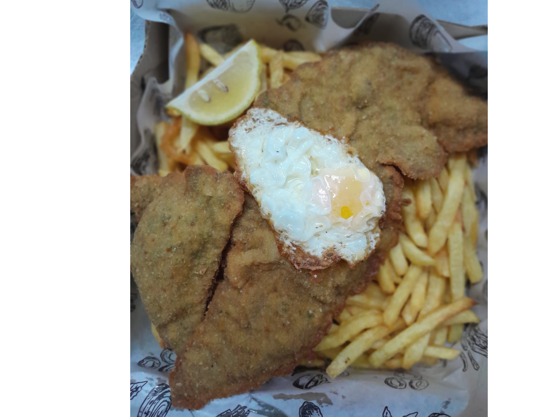 Milanesa a caballo con fritas