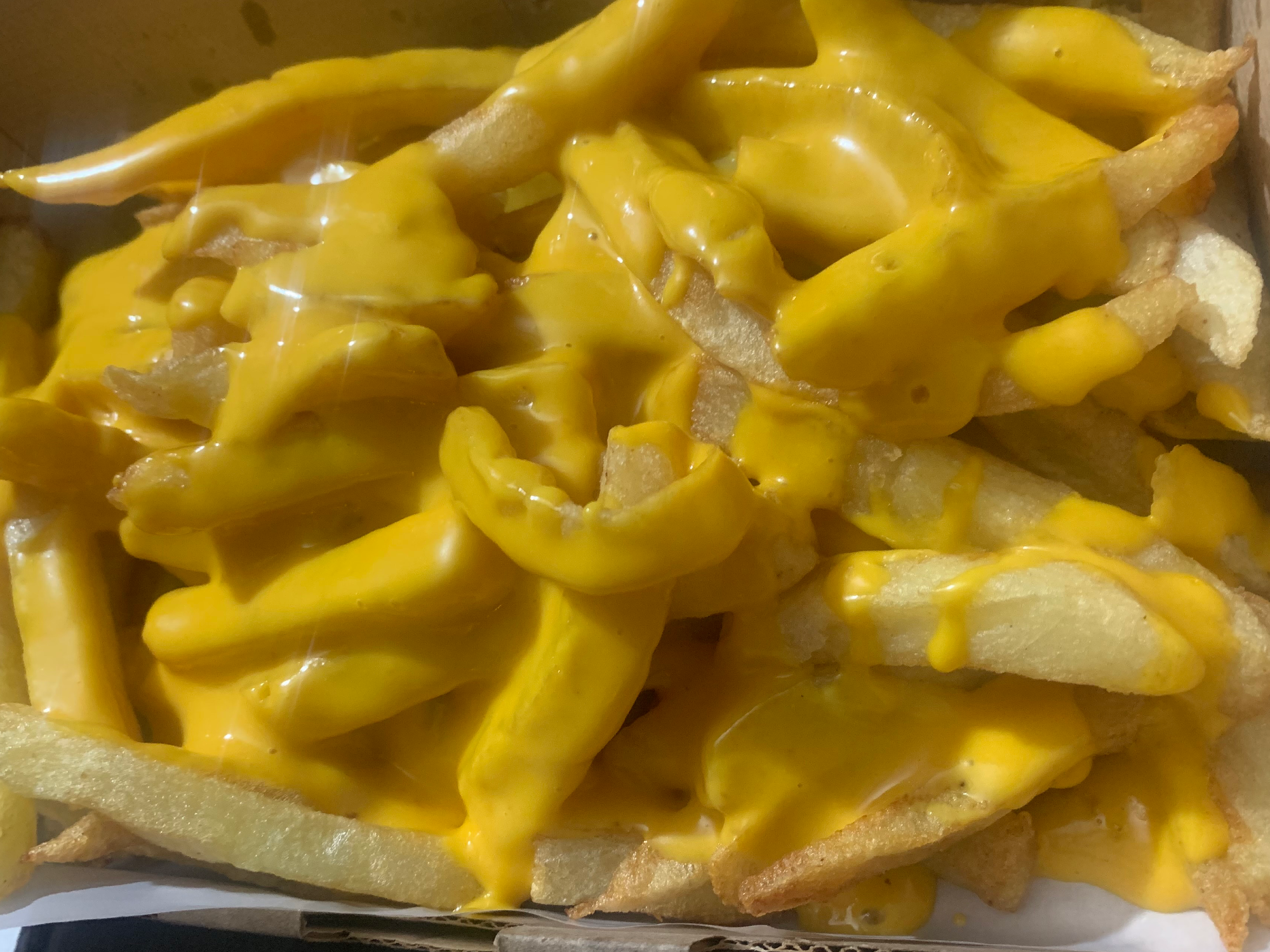 Porción de fritas con Cheddar