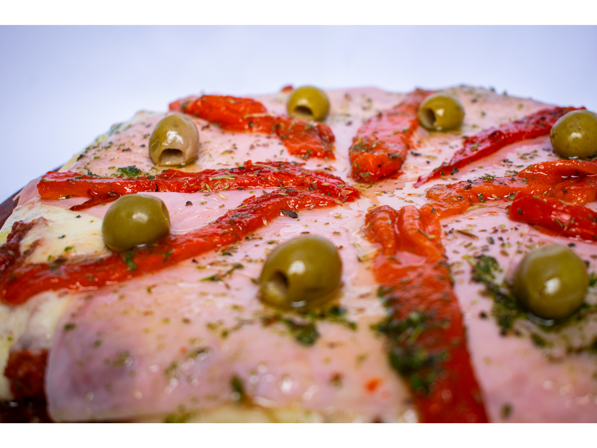 Pizza jamón y morrones de La Redonda