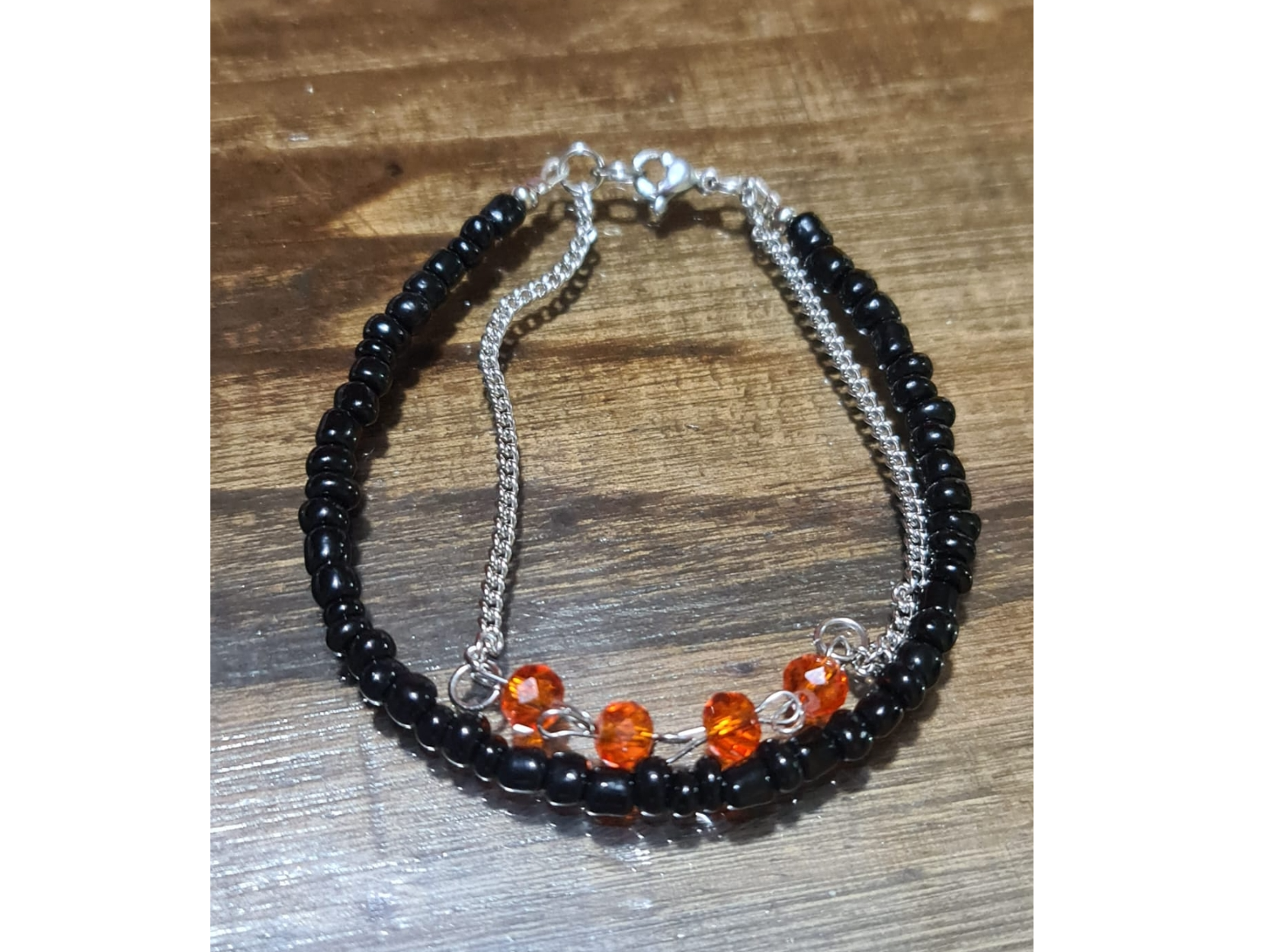 Pulsera doble negra y naranja