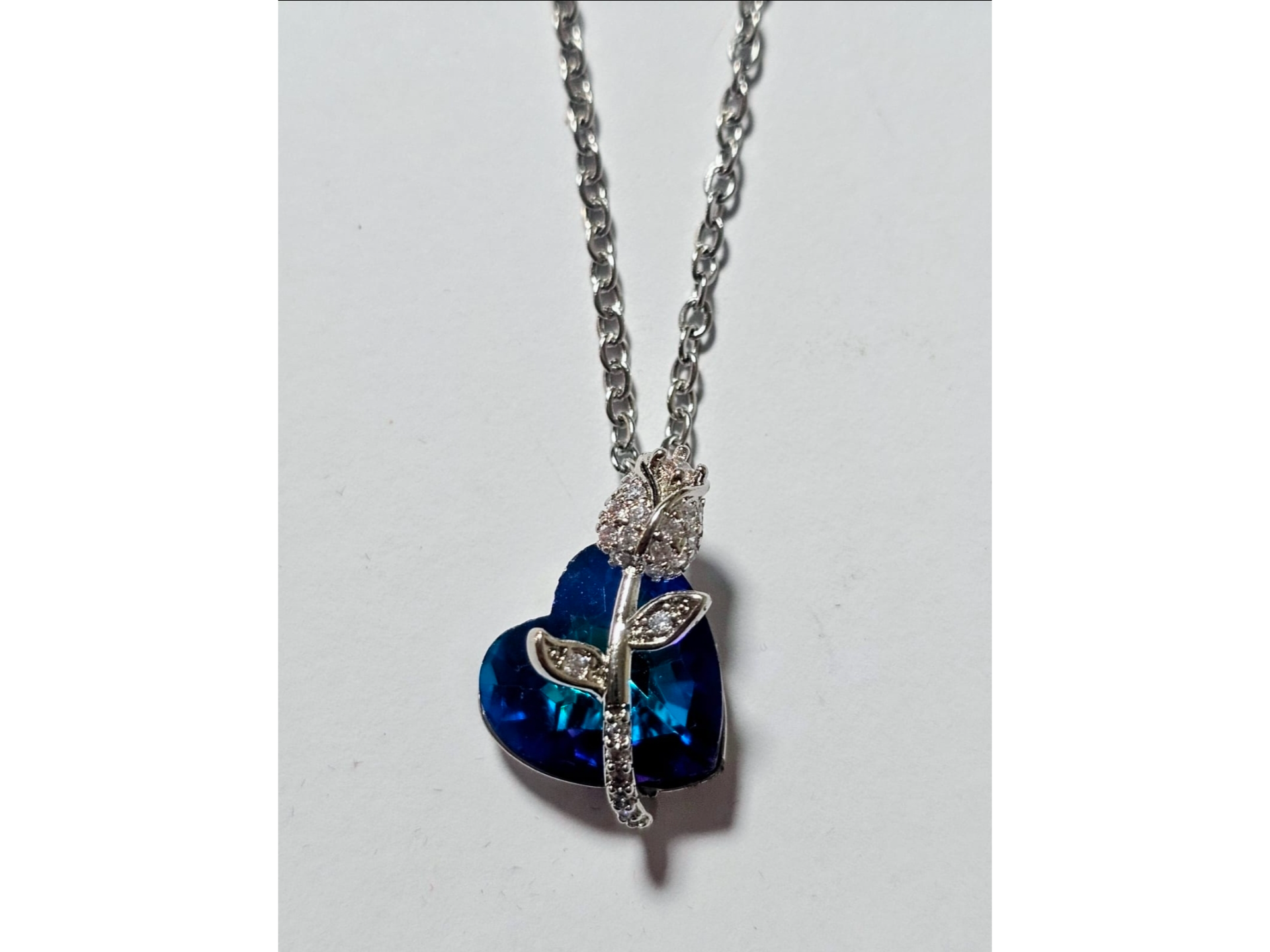 Dije corazon azul con rosa