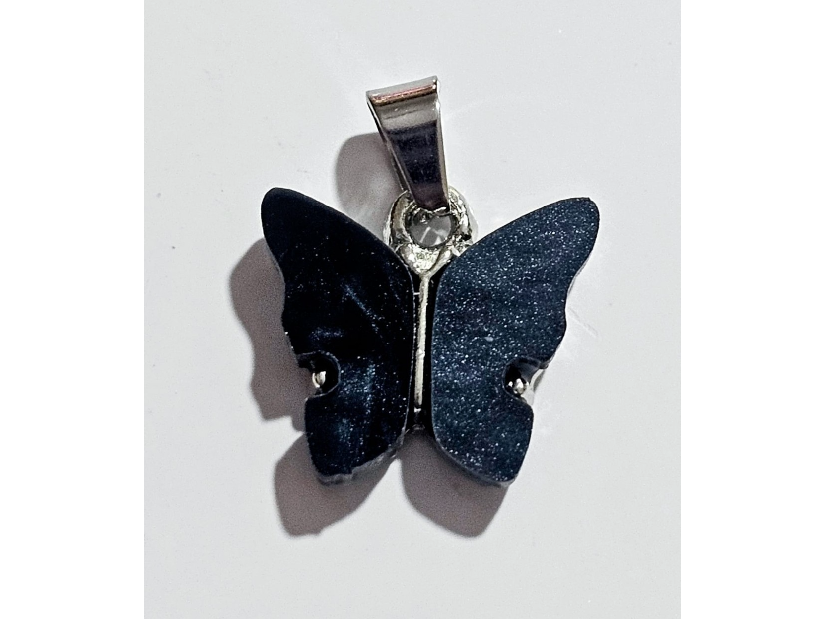 Dije mariposa negra