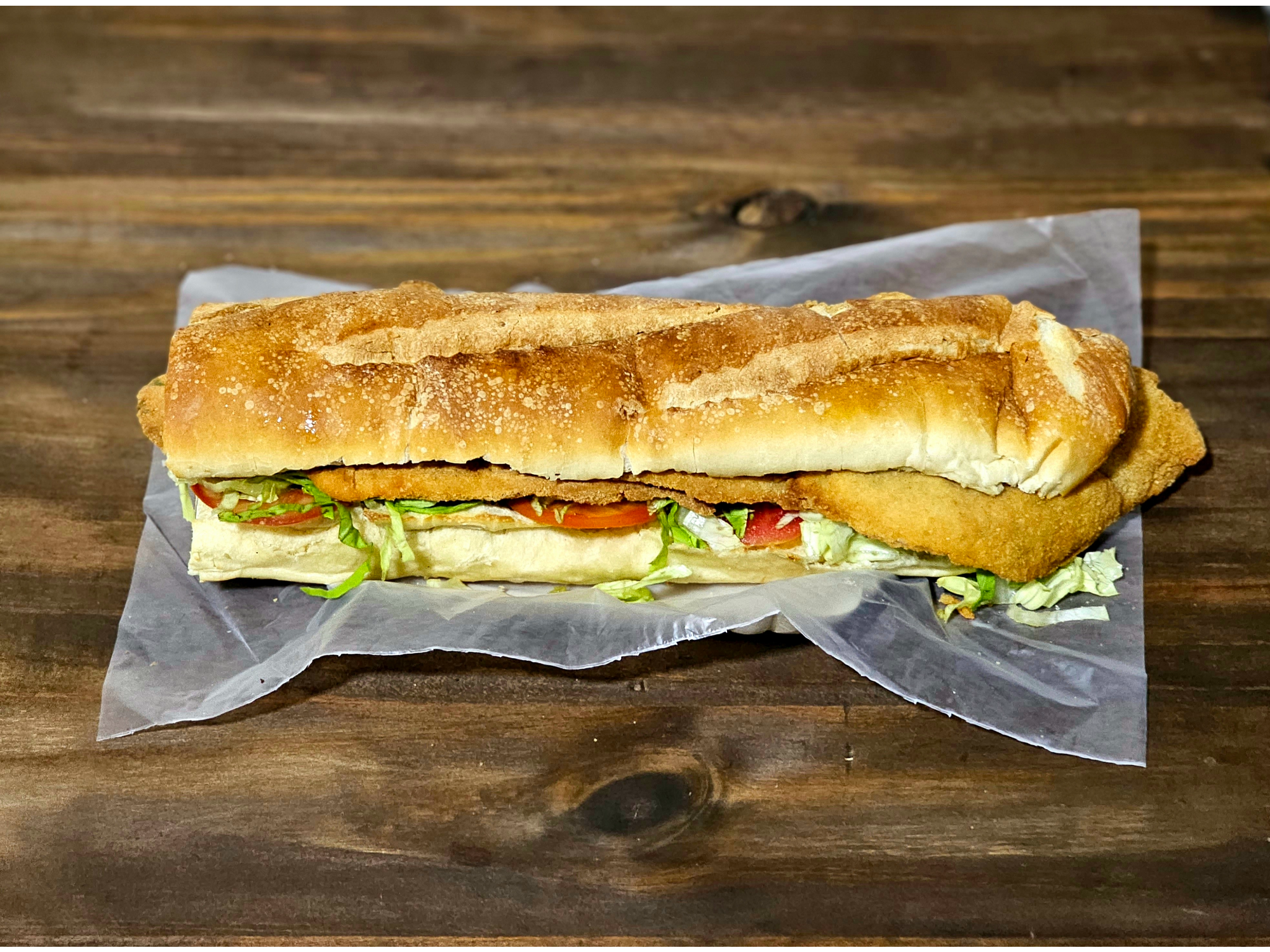 Milanesa con lechuga y tomate