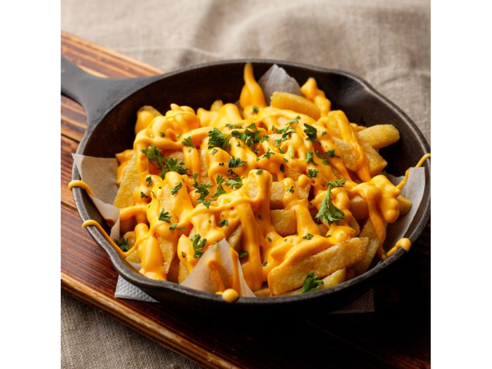 Papas con cheddar y verdeo