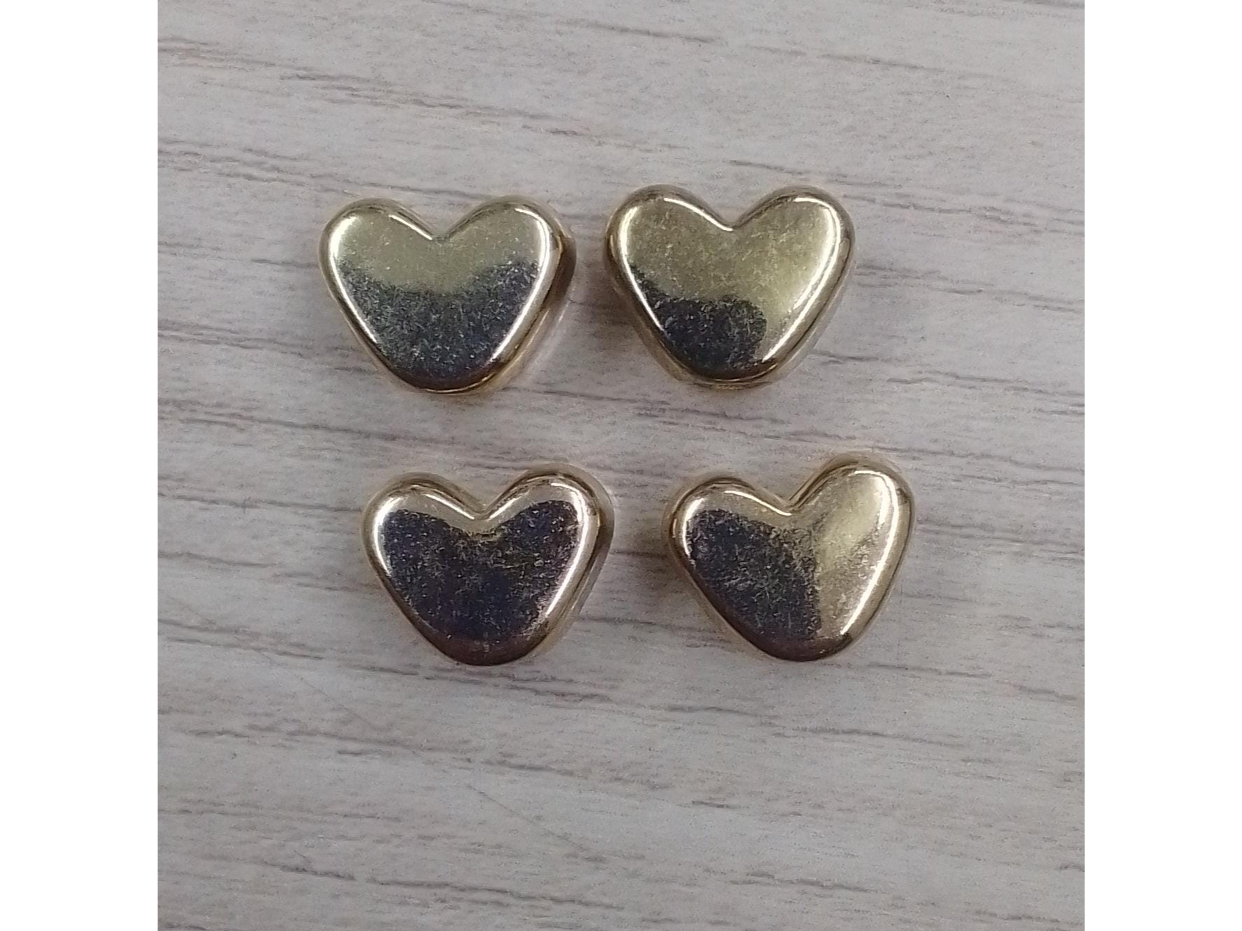 Dije corazon plastico pequeño