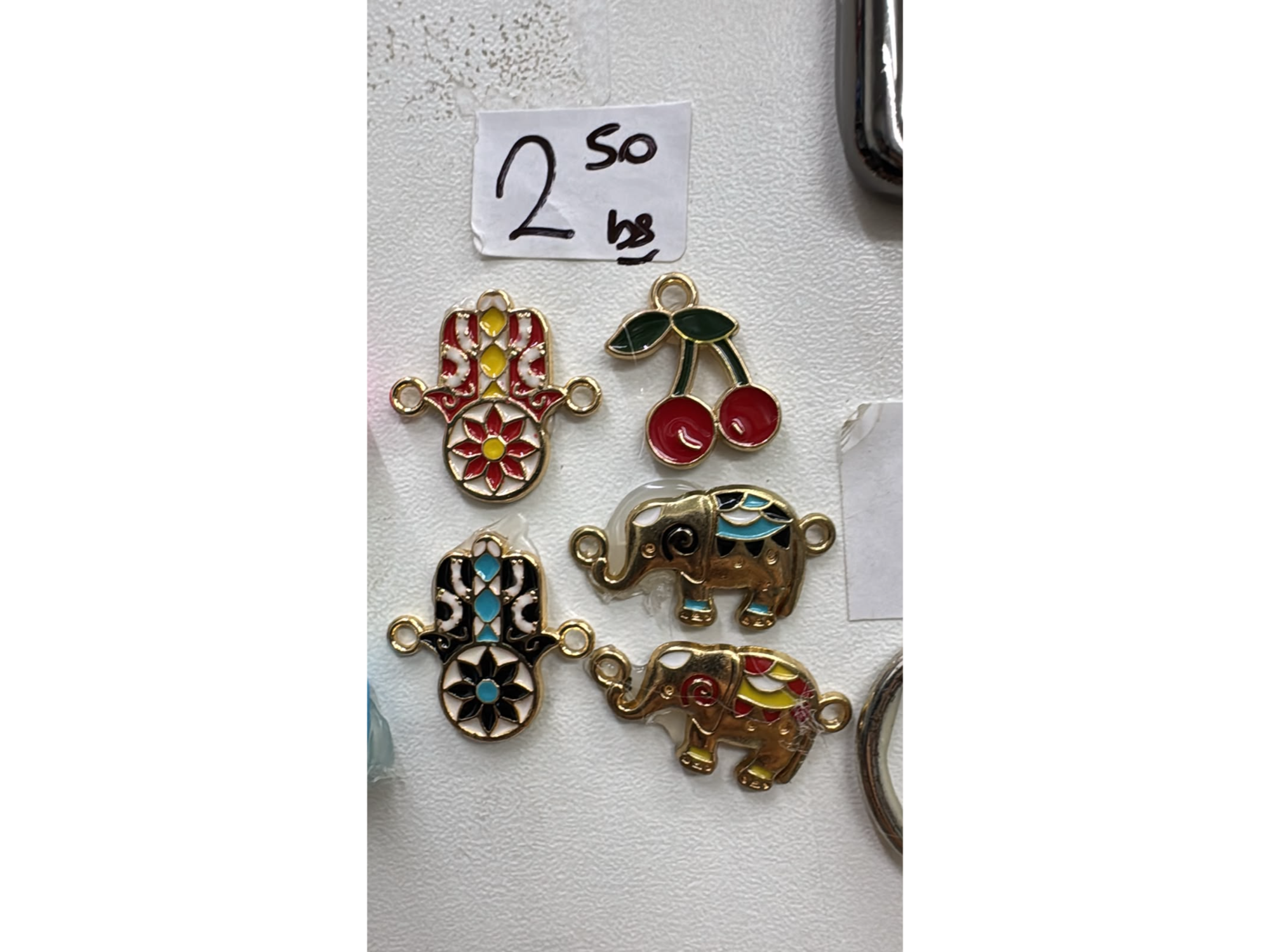 Dijes metal elefante + manito + cereza x unidad