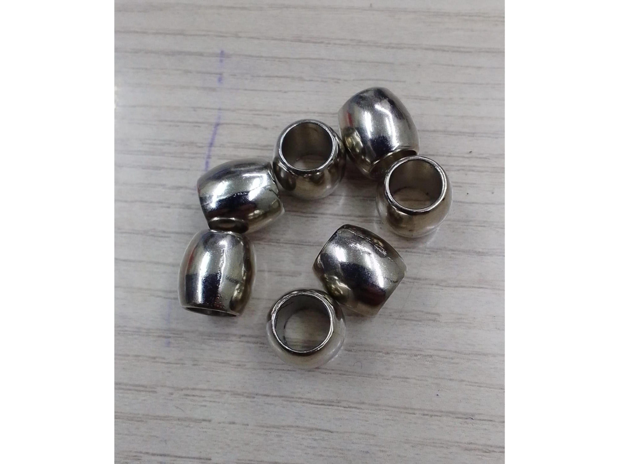 Pasa cordon plateado Brasil 6mm (orificio)