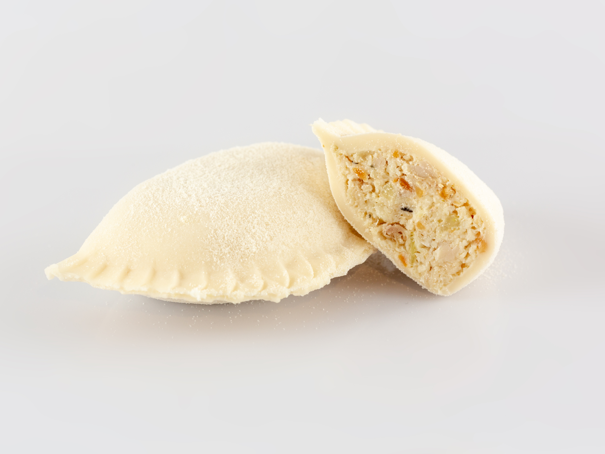TORTELLONI DE POLLO, HINOJO, MANI TOSTADO Y LECHE DE COCO
