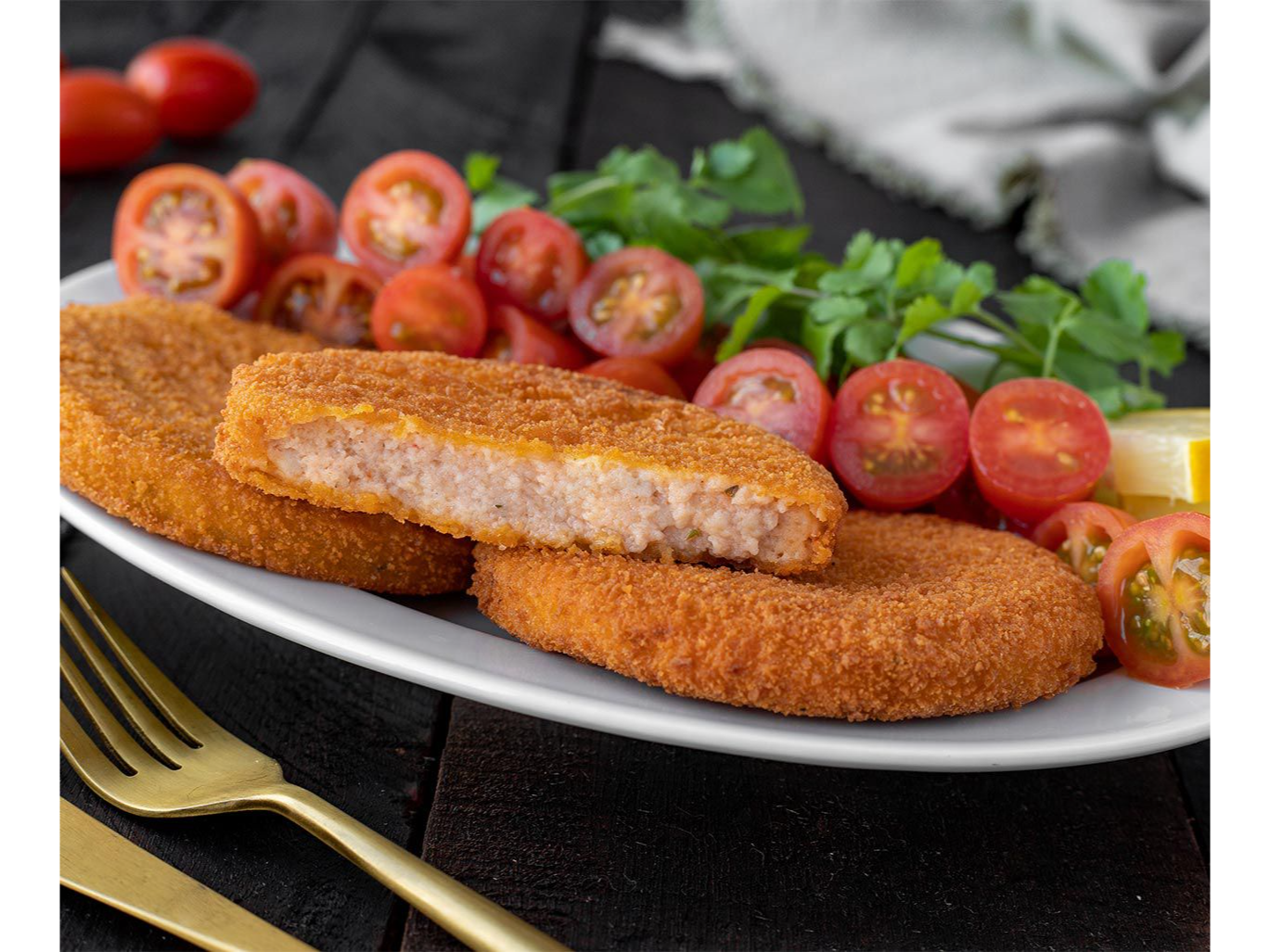 Medallón de merluza con tomate y queso