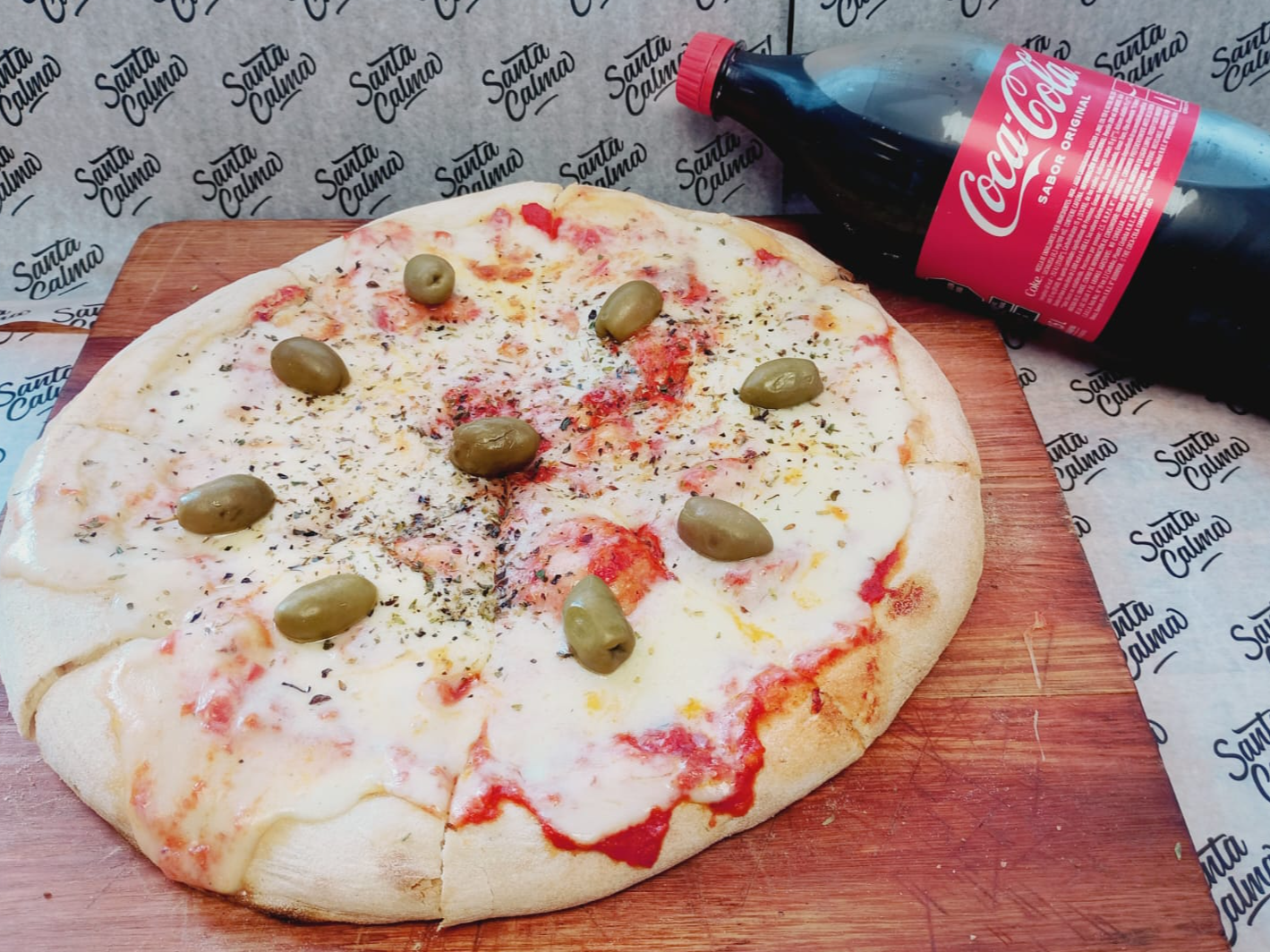 1 Pizza 8 porciones + bebida de 1 1/2