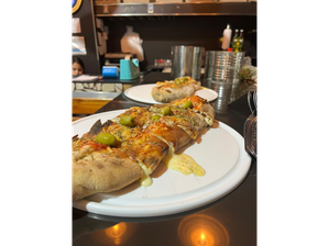 calzone calabresa de Pizzeria los compadres